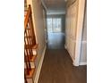 Hallway features hardwood floors, leading to a bright living area with sliding glass doors to the backyard at 1799 Timber Valley Se Way, Smyrna, GA 30080