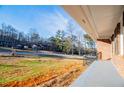 Covered front porch with steps leading to the front door at 4027 Lauada Dr, Douglasville, GA 30135