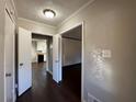 Bright entryway with hardwood floors, leading to kitchen and living room at 4208 Rue Saint Michel, Stone Mountain, GA 30083