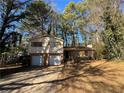 Two-story house with a two-car garage and spacious yard at 4208 Rue Saint Michel, Stone Mountain, GA 30083