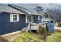 Side view of a charming ranch home with gray siding and deck at 2515 Impala Dr, Cumming, GA 30041