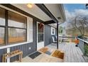 Inviting front porch with rocking chairs and decorative welcome mat at 2515 Impala Dr, Cumming, GA 30041