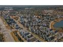 Aerial view of a community with houses, pool, and tennis courts at 7535 Cordery Rd, Cumming, GA 30040