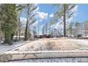 View of the house from across the street with a snow-covered yard at 1833 Boulderview Se Dr, Atlanta, GA 30316