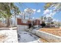 Brick ranch house with attached garage and a retaining wall in front at 1833 Boulderview Se Dr, Atlanta, GA 30316