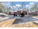 Brick ranch house with attached garage and a small yard at 1833 Boulderview Se Dr, Atlanta, GA 30316