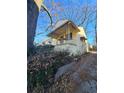 Front view of a yellow house with a porch and a yard at 1140 Ira Sw St, Atlanta, GA 30310