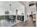 Farmhouse-style dining room with wooden table and black chairs at 3346 Long Creek Dr, Buford, GA 30519