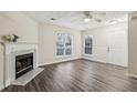 Living room with fireplace and wood-look floors at 1025 Rock Creek Ln, Norcross, GA 30093