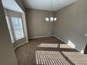 Spacious dining area with bay window and carpet flooring at 5226 Oaktree Trl, Lithonia, GA 30038