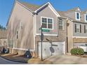 Side view of townhome showcasing gray siding and brick details at , Stone Mountain, GA 30083