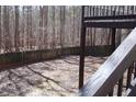 Spacious backyard with wooden fence and access from deck at 205 Hardman Way, Woodstock, GA 30188