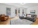 Bright living room with hardwood floors, ample natural light, and comfortable seating at 3901 Old Atlanta Station Se Dr, Atlanta, GA 30339