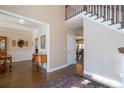 Two story foyer with hardwood floors and views to dining room at 5412 Wild Flower Ct, Powder Springs, GA 30127