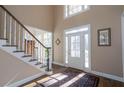 Bright and spacious entryway with hardwood floors and staircase at 5412 Wild Flower Ct, Powder Springs, GA 30127