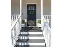 Inviting front door entry with a wreath and white planter boxes at 3581 Drum Roll Ln, Snellville, GA 30039