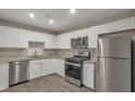 Modern kitchen with stainless steel appliances and granite countertops at 2599 Fieldstone View Se Ln, Conyers, GA 30013