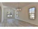 Bright dining room with hardwood floors and natural light at 7650 Abbey Glen Dr, Cumming, GA 30028