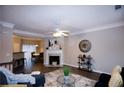 Open living room features a fireplace and hardwood floors at 740 Abbotts Mill Ct, Johns Creek, GA 30097