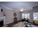 Spacious living room with fireplace and hardwood floors at 740 Abbotts Mill Ct, Johns Creek, GA 30097