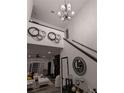 Bright entryway with staircase, chandelier, and decorative console table at 2587 Alvecot Cir, Atlanta, GA 30339