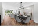 Open concept kitchen and dining area with hardwood floors at 622 Bellemeade Nw Ave # 7, Atlanta, GA 30318