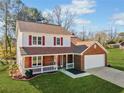 Two-story house with red shutters and a brick facade at 4496 Whitt Station Nw Run, Acworth, GA 30101