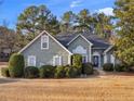 House exterior showcasing light teal siding and landscaping at 10 Lindsey Ct, Mcdonough, GA 30252