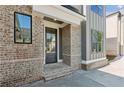 Charming front door and exterior brickwork adding curb appeal to this inviting home at 116 Cottage Gate Ln, Roswell, GA 30076