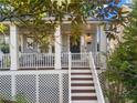 Two-story home with wrap-around porch and stairs leading to the front door at 821 Edgewood Ave # A, Atlanta, GA 30307