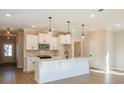 Spacious kitchen with white cabinets, island, and stainless steel appliances at 701 Trevett Way, Marietta, GA 30062