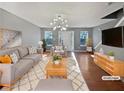 Virtually staged living room with hardwood floors and neutral decor at 2891 Vining Ridge Ter, Decatur, GA 30034