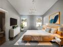 Virtually staged main bedroom with a large bed and ample natural light at 2891 Vining Ridge Ter, Decatur, GA 30034