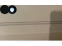 Image shows a peephole on a light beige door at 2786 Laurel Ridge Cir, East Point, GA 30344