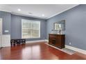 Living Room with hardwood floors and gray walls at 406 Providence Walk St, Canton, GA 30114