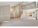 Open living room with high ceilings and neutral color palette at 1001 Heatherwood Ct, Norcross, GA 30093