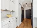 Modern entryway with white shaker cabinets and a barn door at 260 18Th Nw St # 10226, Atlanta, GA 30363