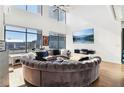 Open living space with circular sectional sofa and city views at 260 18Th Nw St # 10226, Atlanta, GA 30363