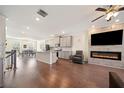 Open living space with hardwood floors, fireplace, and kitchen views at 3075 Westpoint Cir, Snellville, GA 30078