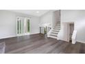 Bright living area with hardwood floors and access to back deck at 6231 Creekford Dr, Lithonia, GA 30058
