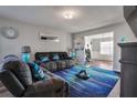 Living room with fireplace, comfortable seating, and large TV at 1762 Wood Stork Dr, Hampton, GA 30228