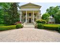 Impressive mansion featuring a classical facade and stone driveway at 4787 Northside Dr, Atlanta, GA 30327