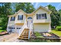 Two-story house with attached garage and landscaping at 121 Orchard Dr, Temple, GA 30179