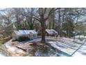 Aerial view of gray house on a snow covered lot at 2505 Mellville Ave, Decatur, GA 30032