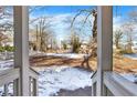 View from porch of backyard with snow on the ground at 2505 Mellville Ave, Decatur, GA 30032