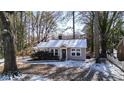 Gray house with white trim and snow covered yard at 2505 Mellville Ave, Decatur, GA 30032