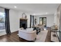 Inviting living room with a fireplace, neutral decor, and access to a deck through glass doors at 7110 Brandon Mill, Sandy Springs, GA 30328