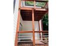 Elevated deck with wooden railings and access from the home's exterior at 1054 Ira Sw St, Atlanta, GA 30310