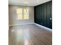 Bright dining room with hardwood floors and a statement wall at 1054 Ira Sw St, Atlanta, GA 30310
