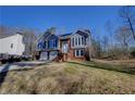 Charming two-story home with a well-manicured front yard and attached two car garage at 3640 Autumn View Nw Dr, Acworth, GA 30101